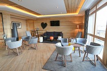 Le Coeur des Loges - lounge met stoelen en tafels